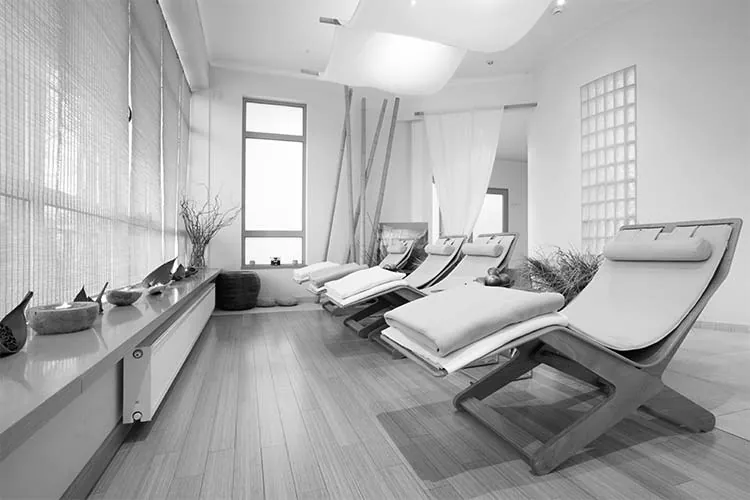 Spa relaxation lounge with reclining loungers and soft daylight